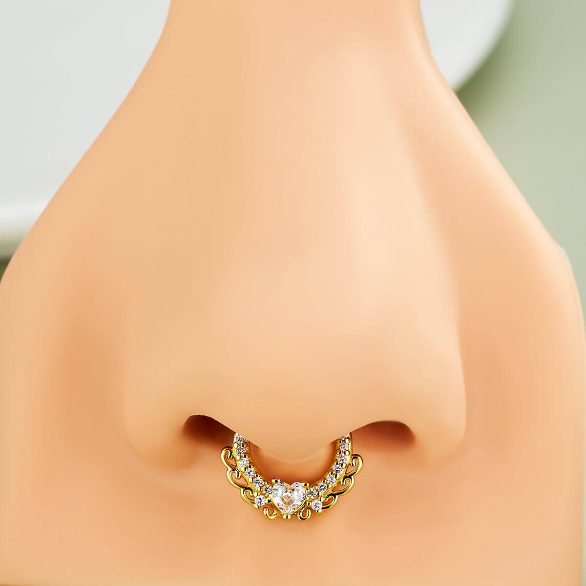 gold heart septum piercing 